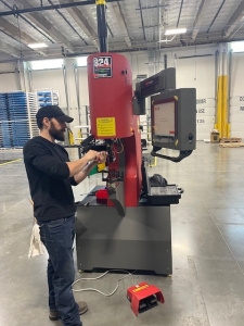 Zach installing new Haeger machine